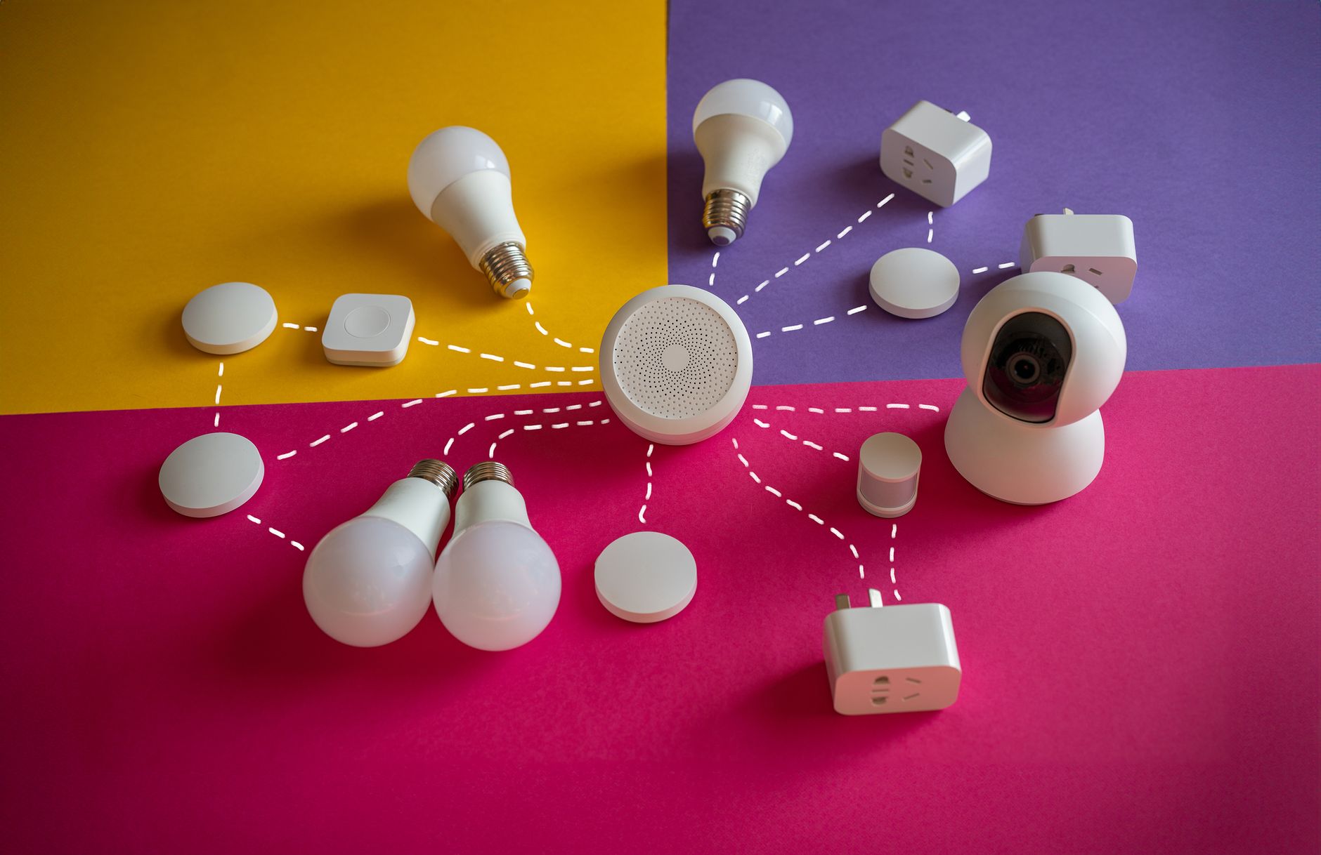 Smart-home bulbs, sensors, and a camera arranged around a central hub.