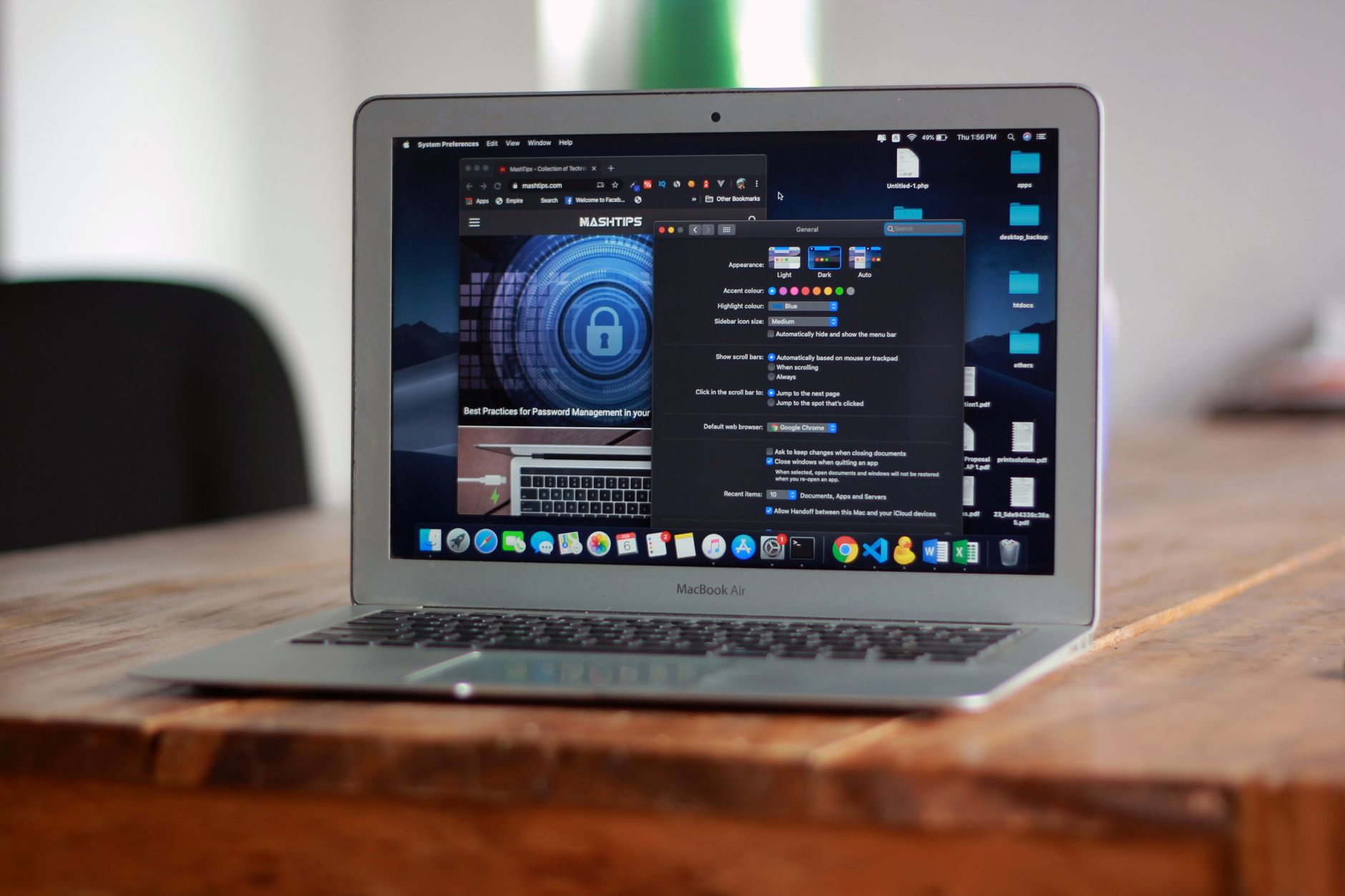 Laptop displaying a web browser and desktop applications.